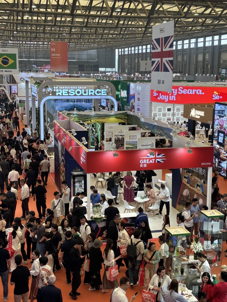 The AHDB stand in the exhibition hall surrounded by people